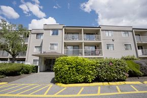 Abbotsford apartment for rent - Apartment building with a yellow parking lot in front.