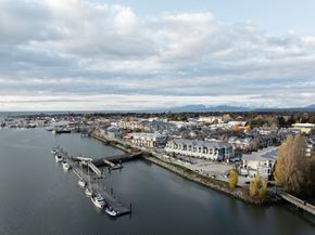 Richmond apartment for rent - A marina with boats docked and buildings in the background.