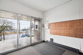 Abbotsford apartment for rent - A room with a row of mailboxes on the wall.