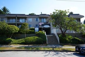 New Westminster apartment for rent - Apartment building with a tree in front of it.
