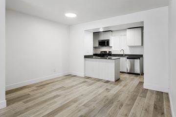 Tempe apartment for rent - A kitchen with a white countertop and a microwave above it.
