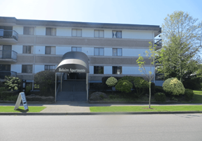 Surrey apartment for rent - A building with the name "Relaie Apartments" on a sign in front of it.