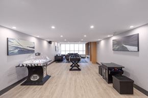 Port Coquitlam apartment for rent - a large room with a dj booth and other equipment in a white room with lights
