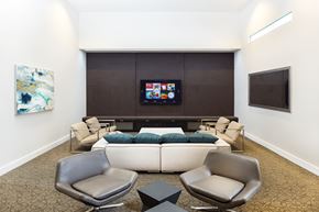 Richmond apartment for rent - A living room with a couch, chairs, and a television.