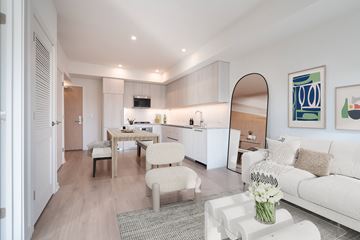 Los Angeles apartment for rent - A modern living room with a white couch and a coffee table.