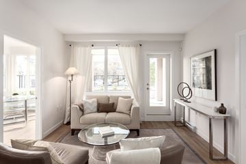 New Westminster apartment for rent - A living room with a glass table and a couch.