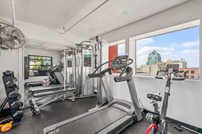 Los Angeles apartment for rent - A gym with treadmills, weights, and exercise bikes.