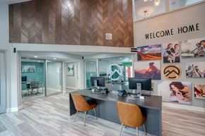Mesa apartment for rent - A modern office space with a wooden ceiling and a "Welcome Home" sign.