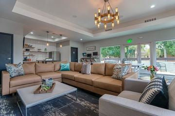 Mesa apartment for rent - A living room with a brown couch and a coffee table.