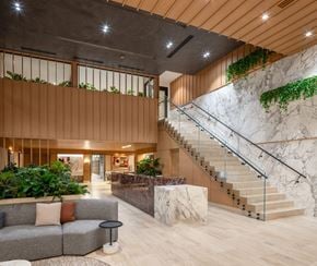 Los Angeles apartment for rent - A modern living room with a staircase and a couch.