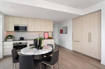 Los Angeles apartment for rent - A modern kitchen with a dining table and chairs.