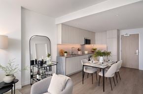 Los Angeles apartment for rent - A modern dining room with a glass table and chairs.