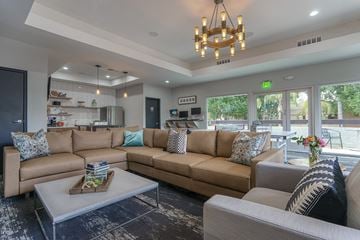 Mesa apartment for rent - A living room with a large sectional sofa and a coffee table.