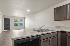 Pine City triplex for rent - Kitchen looking into living room.