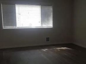 Bremerton apartment for rent - A room with a window covered in blinds.