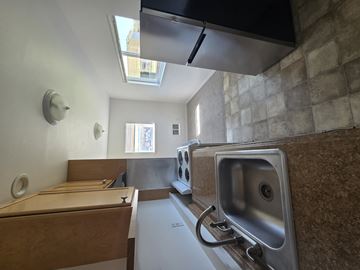 Poulsbo apartment for rent - A kitchen with a sink and a window.