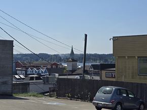 Poulsbo apartment for rent - A grey car is parked in a parking lot.