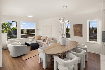 Bremerton townhouse for rent - A modern living room with a large table and chairs.