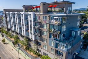 Bremerton townhouse for rent - an aerial view of a large apartment building with balconies and decks at Spyglass Hill Apartments, Bremerton, 98337