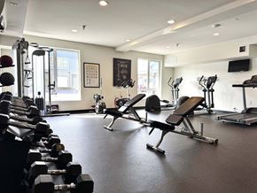 Bremerton townhouse for rent - A gym with a variety of equipment including dumbbells, benches, and treadmills  at Spyglass Hill Apartments, Bremerton, 98337