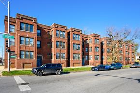 Chicago apartment for rent - a row of brick apartment buildings on a city street