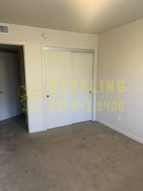 Monterey apartment for rent - A room with a door and a Sterling logo on the wall.