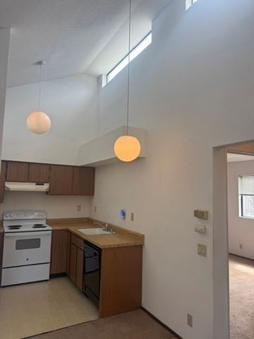 Monterey apartment for rent - A kitchen with a white stove and wooden cabinets.