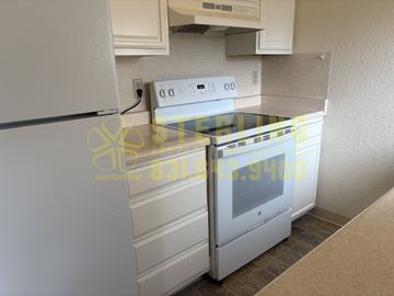 Monterey apartment for rent - A white fridge and oven in a kitchen.
