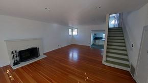 Monterey apartment for rent - a living room with a fireplace and a wooden floor
