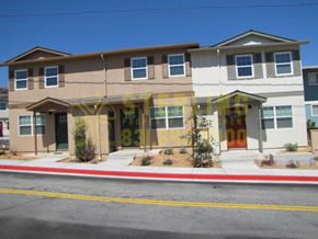 Marina townhouse for rent - A two story house with a brown and white exterior.