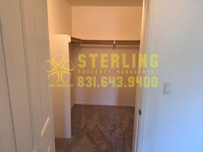 Monterey apartment for rent - A Sterling Property Management logo is displayed on a wall.
