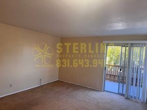 Monterey apartment for rent - A Sterling Property Manager sign is on the wall of an empty room.