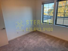 Monterey apartment for rent - A room with a Sterling Property Management logo and contact number on the wall.