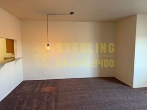 Monterey apartment for rent - A room with a Sterling sign on the wall.