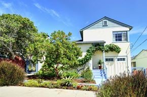 Monterey apartment for rent - a white house with a white fence and a garden