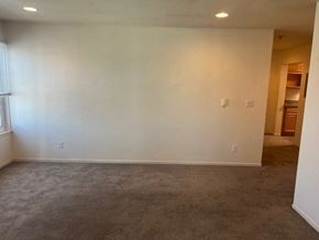Monterey apartment for rent - an empty living room with white walls and carpet