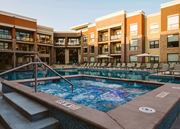 Overland Park apartment for rent - outdoor hot tub surrounded by apartment homes at The Apex at CityPlace, Overland Park, Kansas