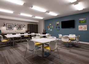 Olathe apartment for rent - Activity Center with tables, chairs, and craft materials at Aspen Ridge 55+ Active Adult Community