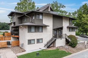Kansas City apartment for rent - A modern two-story house with a balcony on the second floor.