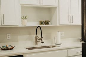 Basehor townhouse for rent - a kitchen sink with a chrome faucet