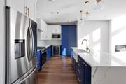 Kansas City apartment for rent - Kitchen with stainless steel appliances and blue cabinets at 44 Washington, Kansas City, MO