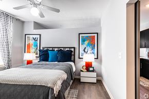 Lenexa apartment for rent - a bedroom with a bed and a ceiling fan  at Waterside Residences on Quivira, Lenexa, Kansas