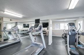 Liberty apartment for rent - A gym with treadmills and exercise bikes.