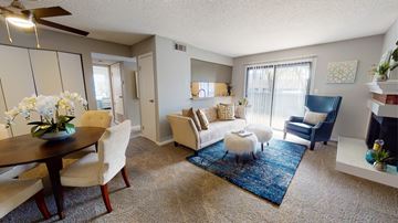 Overland Park apartment for rent - A living room with a dining table and chairs.