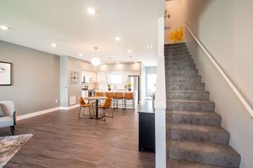 Omaha townhouse for rent - A living room with a dining table and chairs.