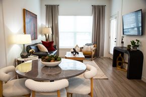 Castle Rock apartment for rent - A modern dining room with a round table and chairs.