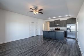 Springdale triplex for rent - A spacious kitchen with dark wood floors and white walls.
