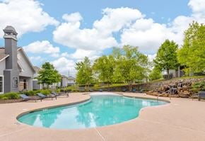 Centerton apartment for rent - sparkling swimming pool with outdoor seating area