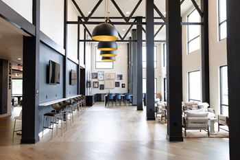 A large room with a long table and chairs.