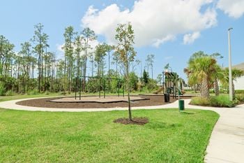 A playground at the whispering winds apartments in pearland, tx